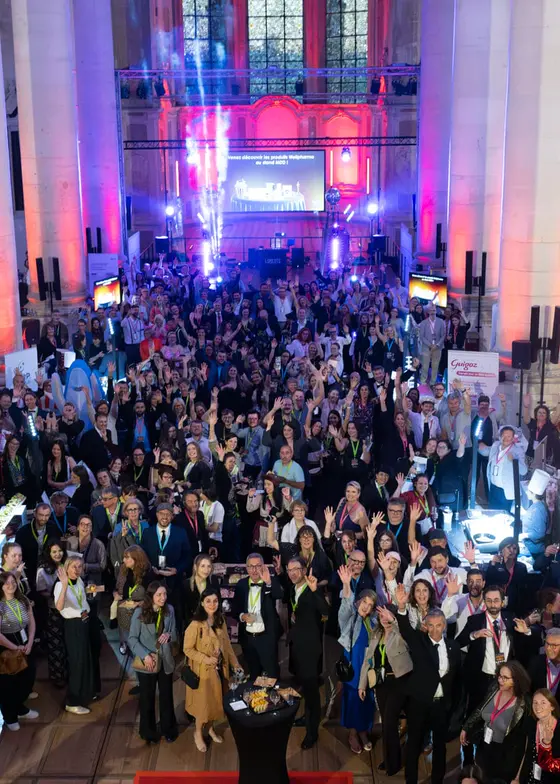 Salle de l'abbaye des Prémontrés pleine pour la soirée des partenaires Wellpharma
